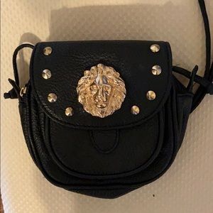 Small black crossbody with lion pendant